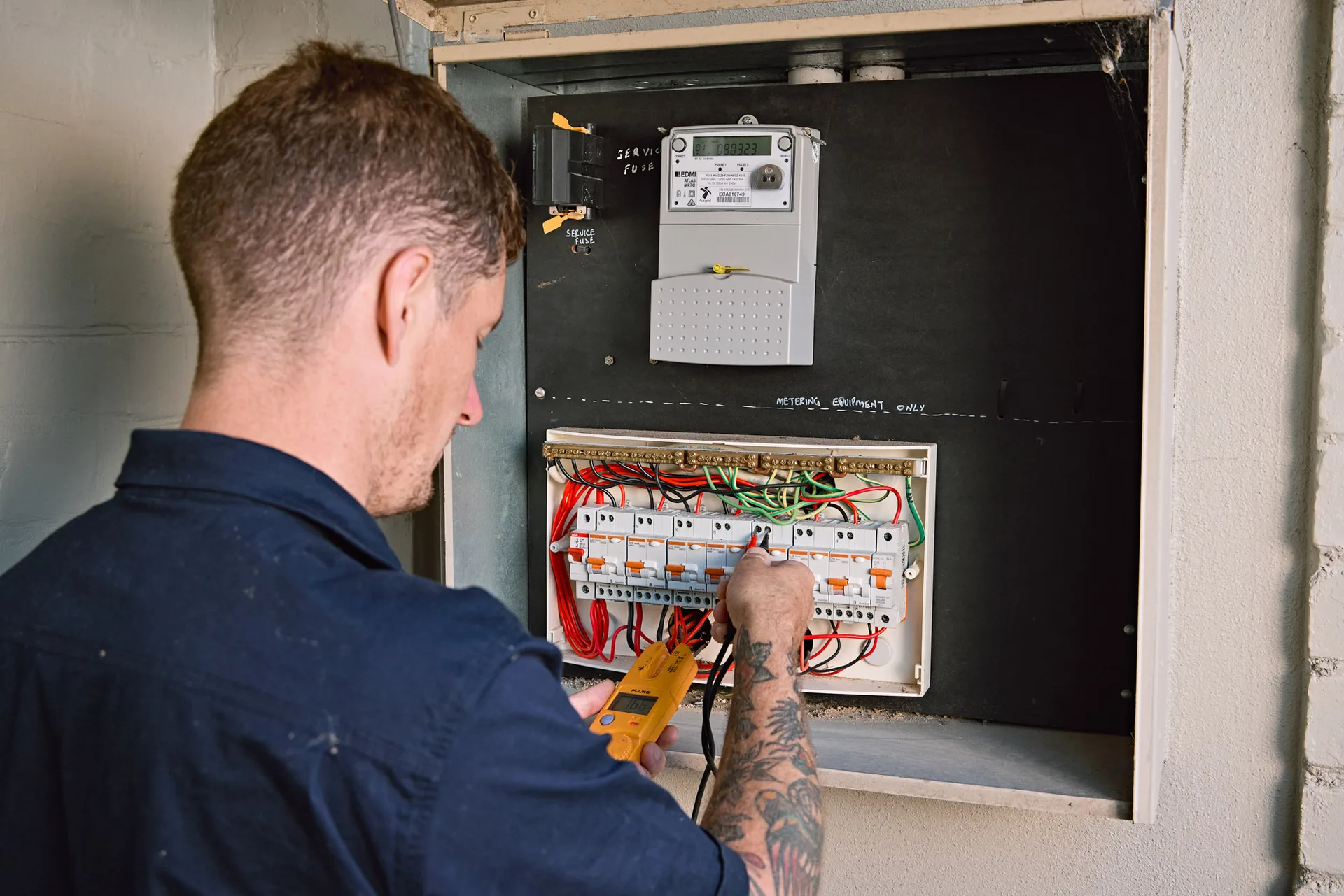 Circuit breakers being checked during an electrical emergency callout